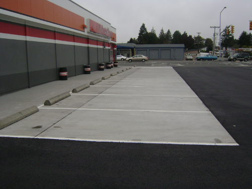 Before photo showing degraded parking lot