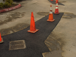 Repaired asphalt awaiting sealcoating